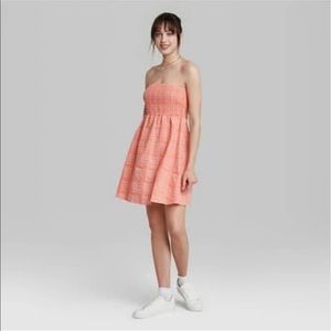 Smocked tube top babydoll dress in Coral